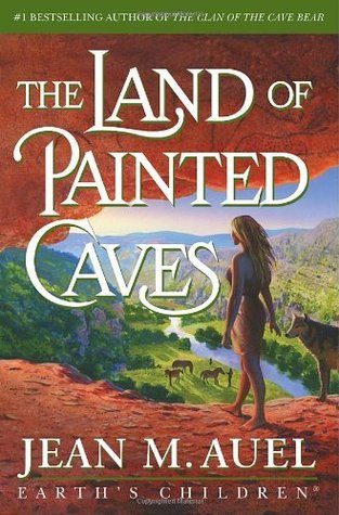 Image of a digital book cover. A blond woman stands in the mouth of a cave with a wolf by her side gazing down into a valley with horses in it.